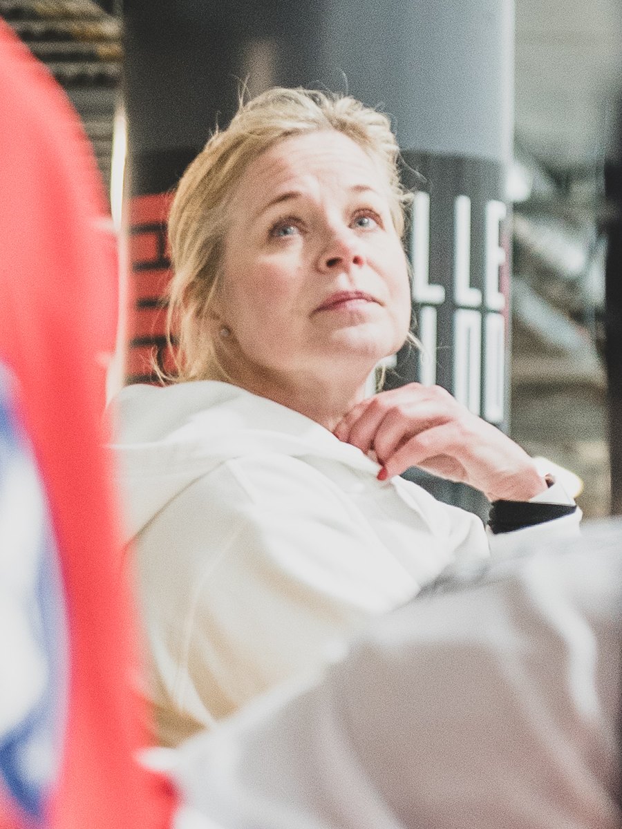 Tiia Hurme watching from the bench during an on ice skating session